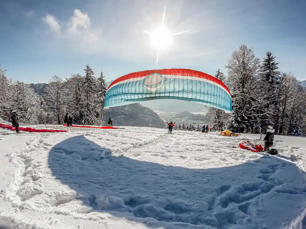 A canopy laid out on snow at the winter launch