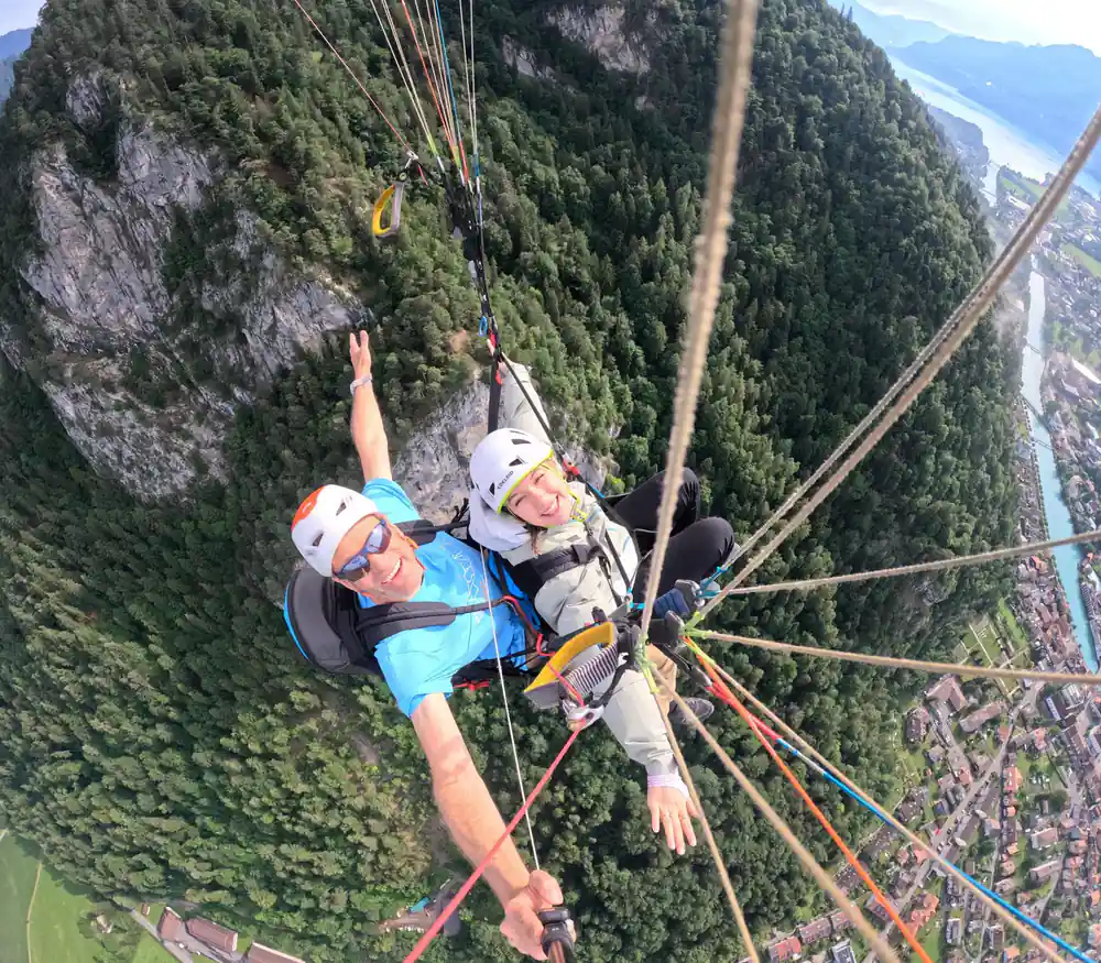 A tandem against the wooded cliff above the town