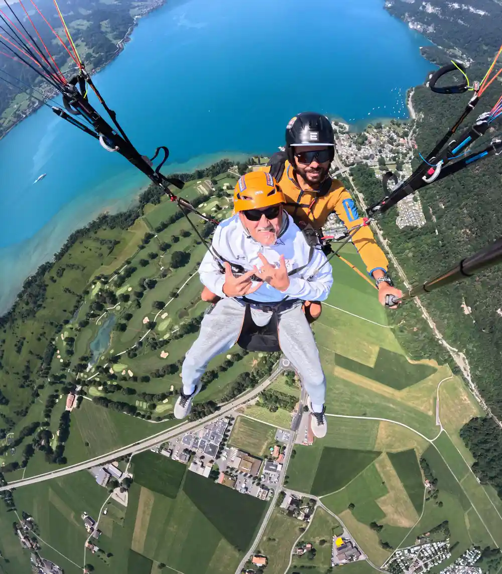 A tandem above the fields beside the lake