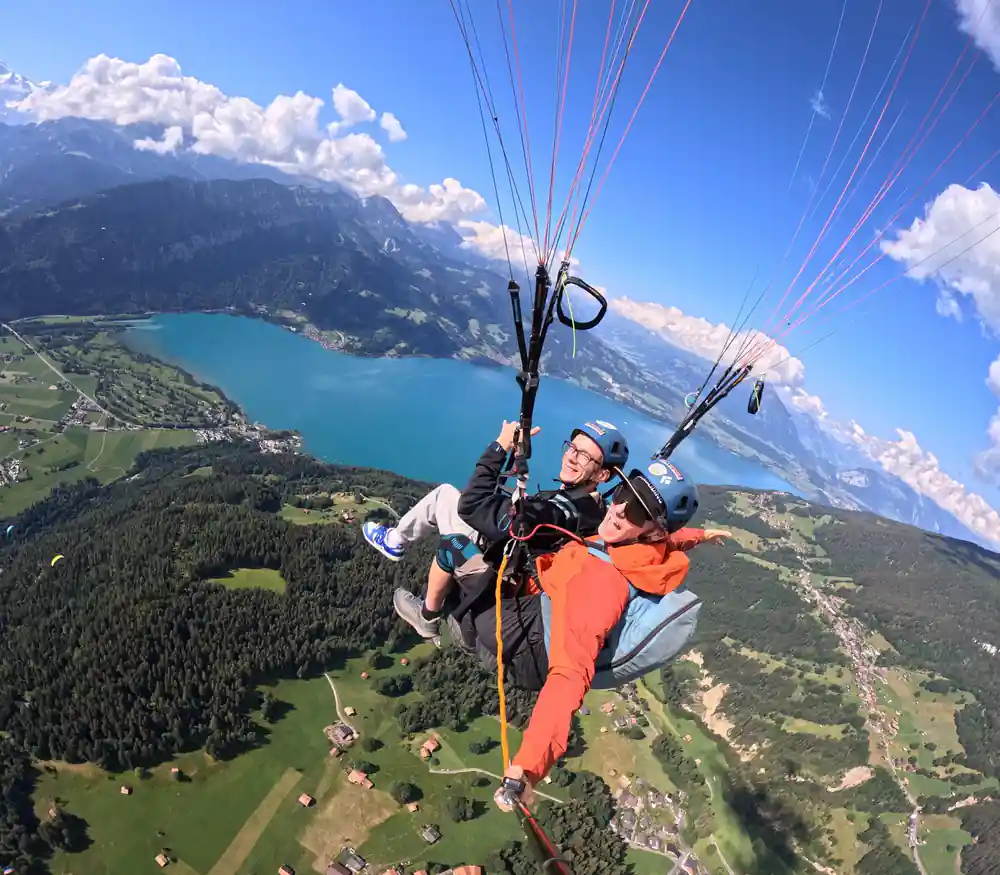 A tandem high above the lake and the wooded shore