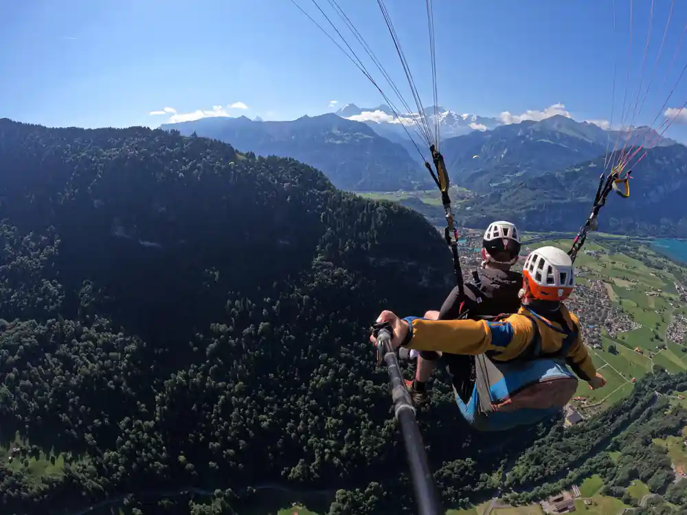 A tandem with the high peaks on the horizon