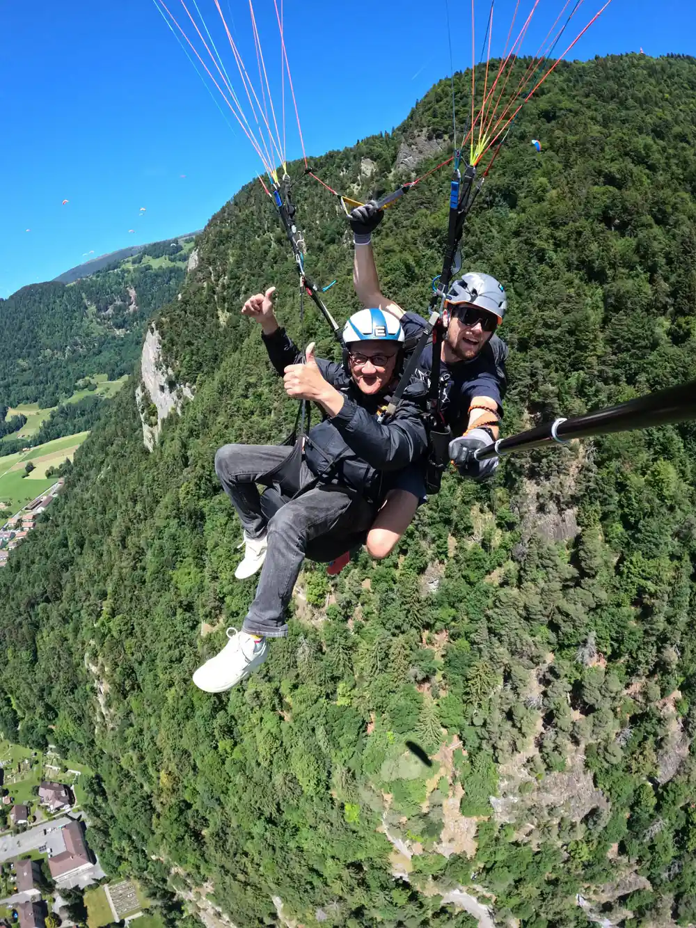 A tandem above the meadows below the ridge