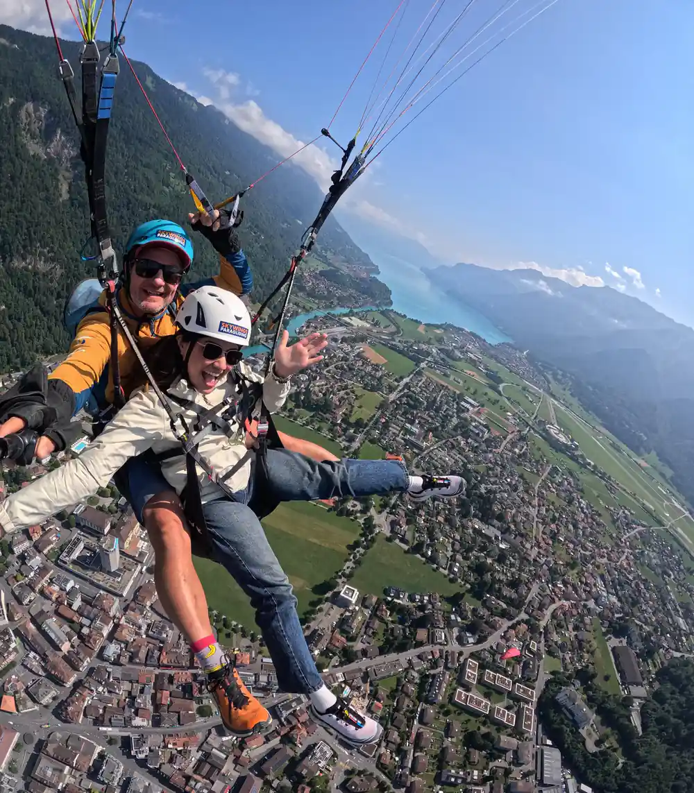 A tandem turning above the town and the lake