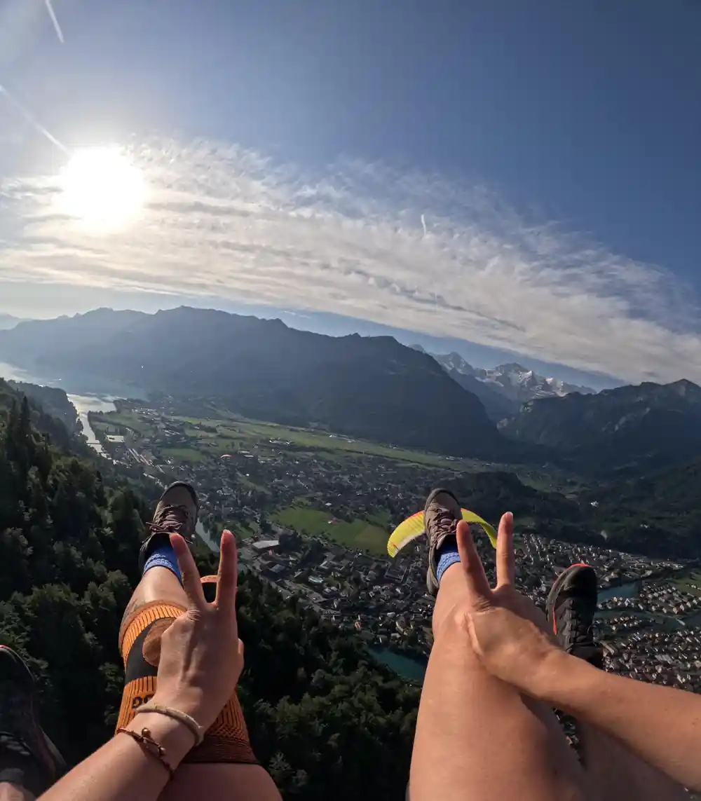 The valley and the town from height, boots in frame