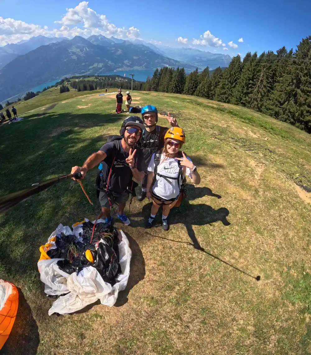 A wing spread on the grass at the top with the lake beyond